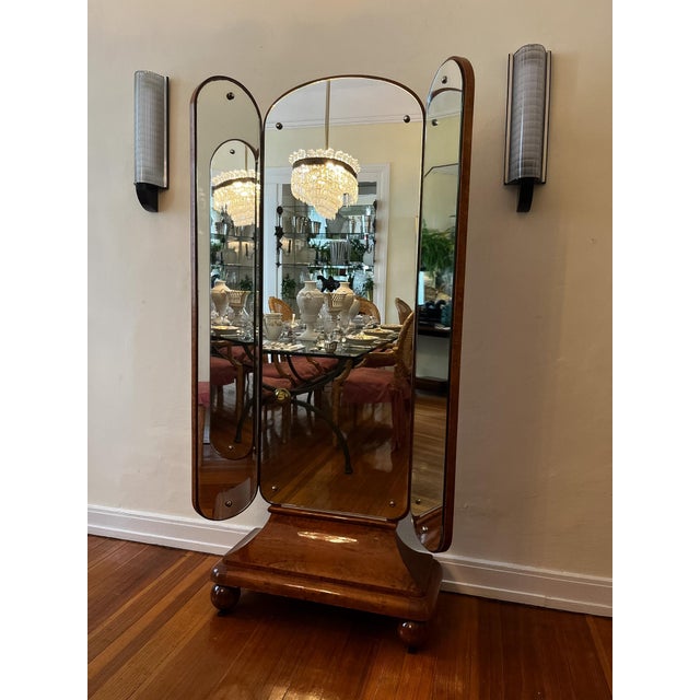 A 1920s-era standing mirror, suitable as a dressing or vanity mirror, finished in beautiful birch veneer. The side panels...