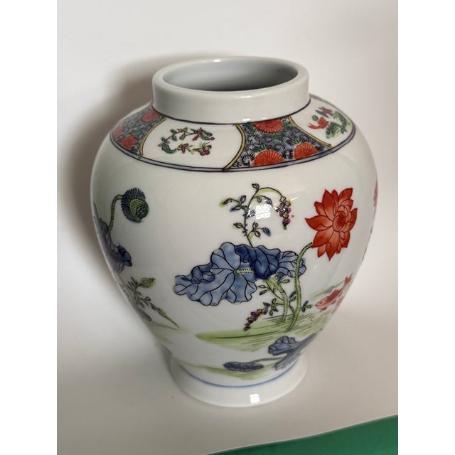Hand Painted Floral Japanese Kakiemon-Style Porcelain Vase often referred to as the ginger jar. It features the Kakiemon...