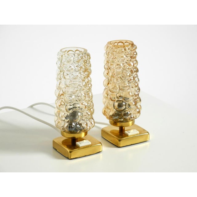 Pair of very rare 1960s brass bedside lamps with golden bubble glass shades. Great, elegant design. Very nice, pleasant...
