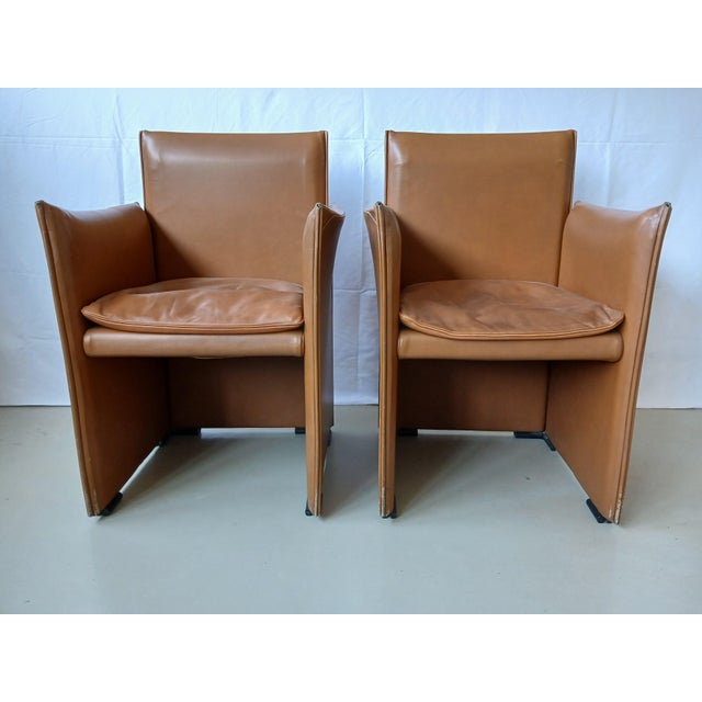 The 401 Break armchair, designed by Mario Bellini in 1976 for Cassina, is an icon of postmodern design, featuring a...