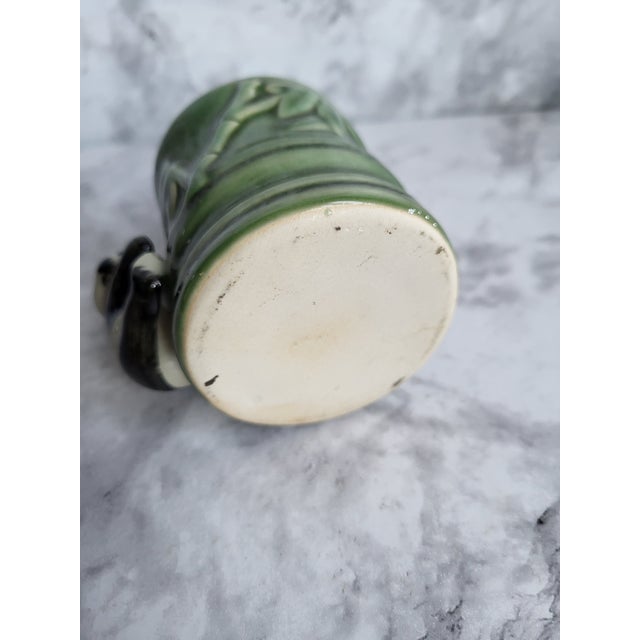 Ceramic miniature planter in bamboo pattern and green glaze. The adorble panda climbing into the bamboo is such a cute...