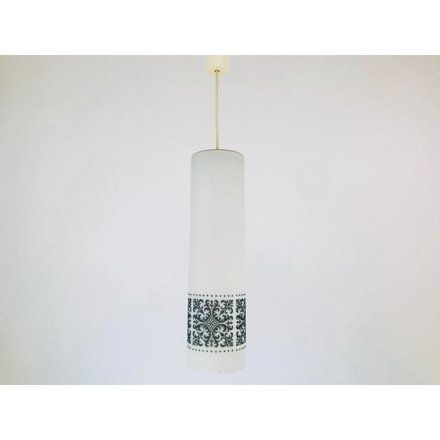 A set of 3 vintage pendant lamps by Glashütte Limburg made in the 1960s in Germany. They are fascinating with its...