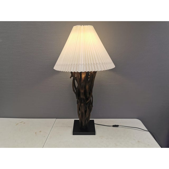 Designer table lamp/floor lamp, likely made from driftwood, giving it a unique, rustic appearance. Very rare and highly...