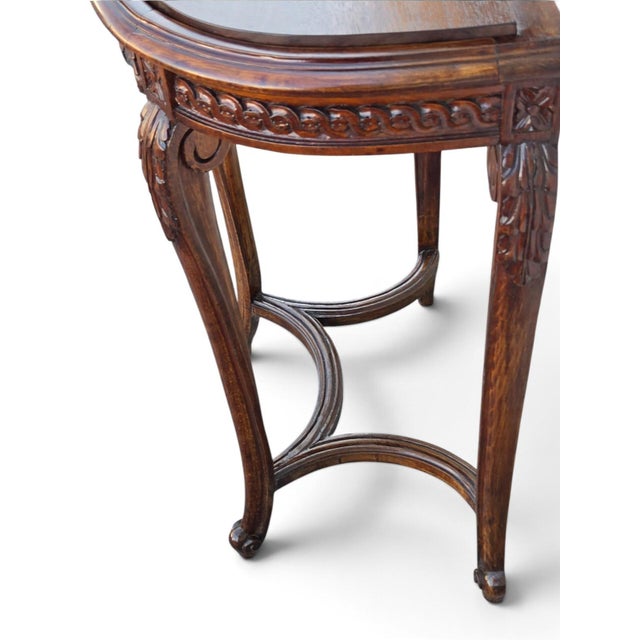 This 19th Century French Walnut Console Table is a stunning piece of antique furniture that exudes elegance and style....