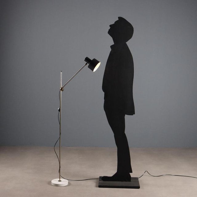 Vintage floor lamp made in Italy with a circular marble base, a metal stem with a height-adjustable arm that can be...