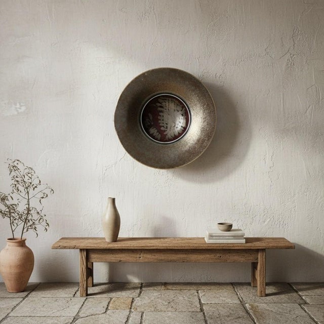 A monumental signed studio pottery raku bowl showcasing dramatic metallic bronze and silver crystalline glazing...