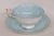 This beautiful footed teacup and saucer has the maker's mark "Paragon, England" on the underneath, as well as the double...