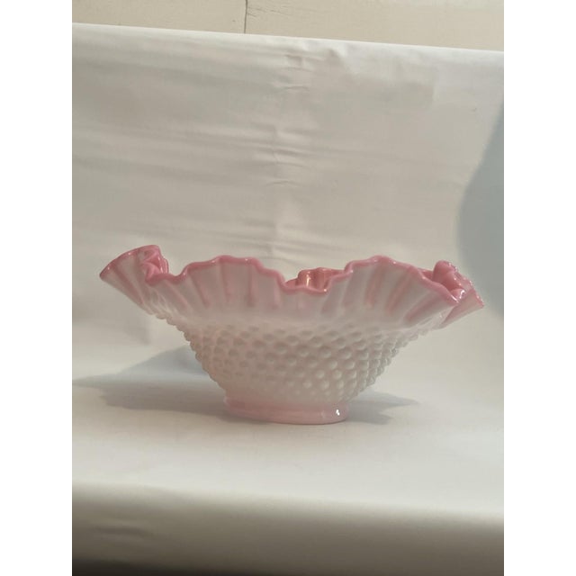 The Fenton Cased Glass Peach Blow Hobnail Ruffled Bowl is a vintage decorative piece originating from America in the Mid...