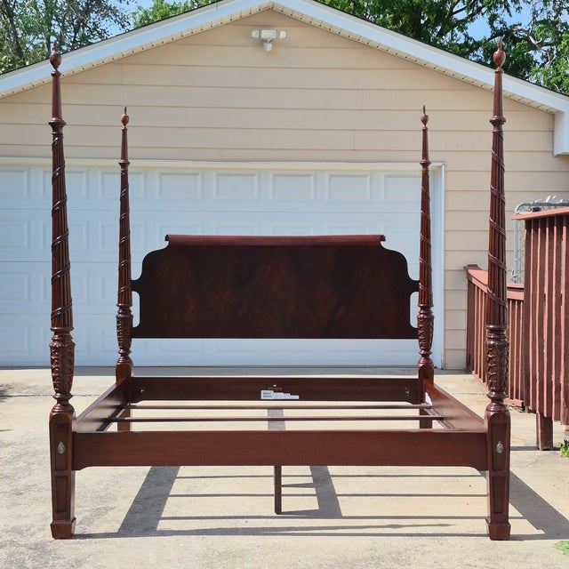 This is an elegant king size carved mahogany poster bed from Ethan Allen’s Newport Collection. The bed features a shaped...