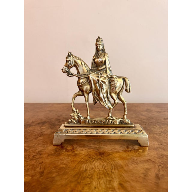 Fine quality pair of antique brass doorstops, having a quality pair of antique brass doorstops mounted with horses and...