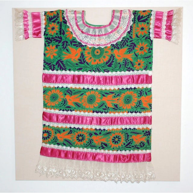 This is a lovely lively embroidered huipil from the Mazatec region of Jalapa de Diaz, Oaxaca, 1960s. It is decorated with...