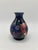 This is a small vintage bud vase by Moorcroft with anemones on a dark blue/cobalt background. It is approximately 5" tall...