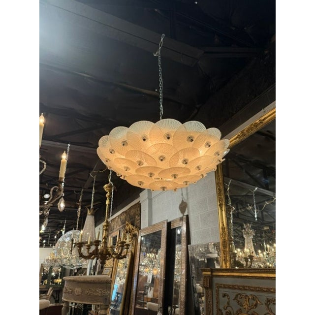 Murano Frost Disc Flush Mount Chandelier. A Murano frost disc flush‑mount chandelier is one of the most iconic forms of...