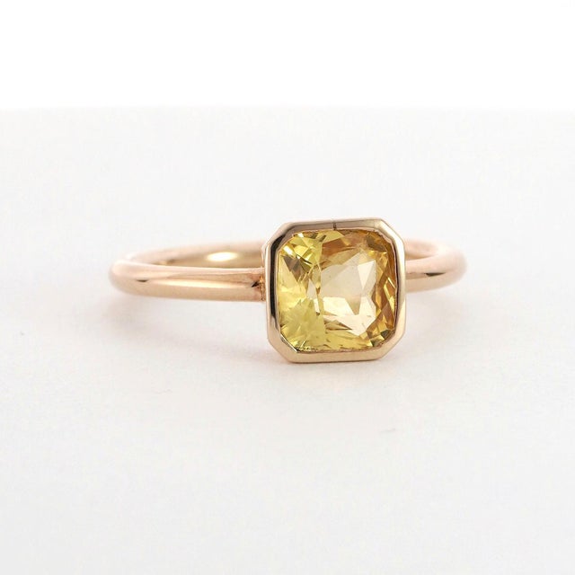 A striking Yellow Sapphire Solitaire Ring, featuring a radiant 2.15ct Yellow Sapphire set in 14k Yellow Gold. Ring size 7.75