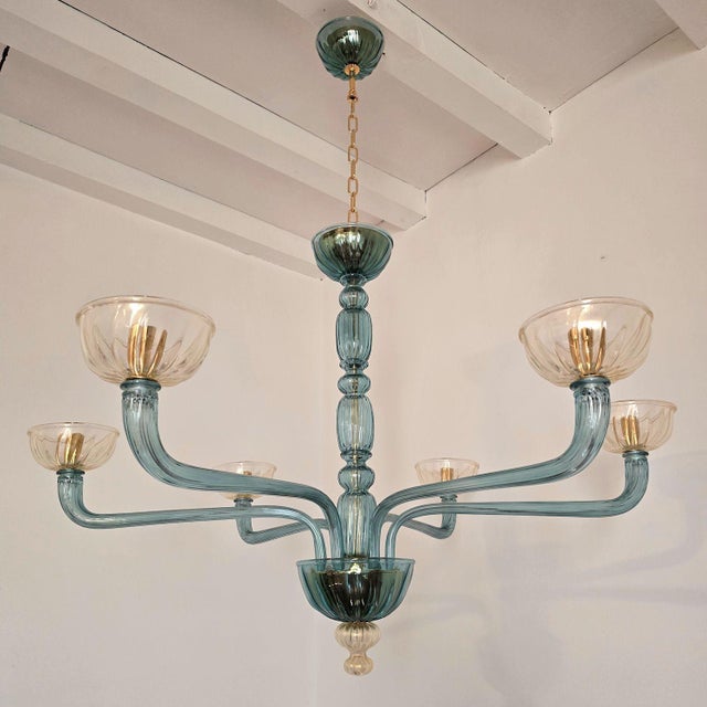 Mid-Century Modern petrol blue and clear-gold Murano glass chandelier Venini style, Italy 1980s The neoclassical style...