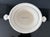 Tureen with lid from the “Dunham” collection by Ralph Lauren Home. This cream earthenware was crafted in England. This...