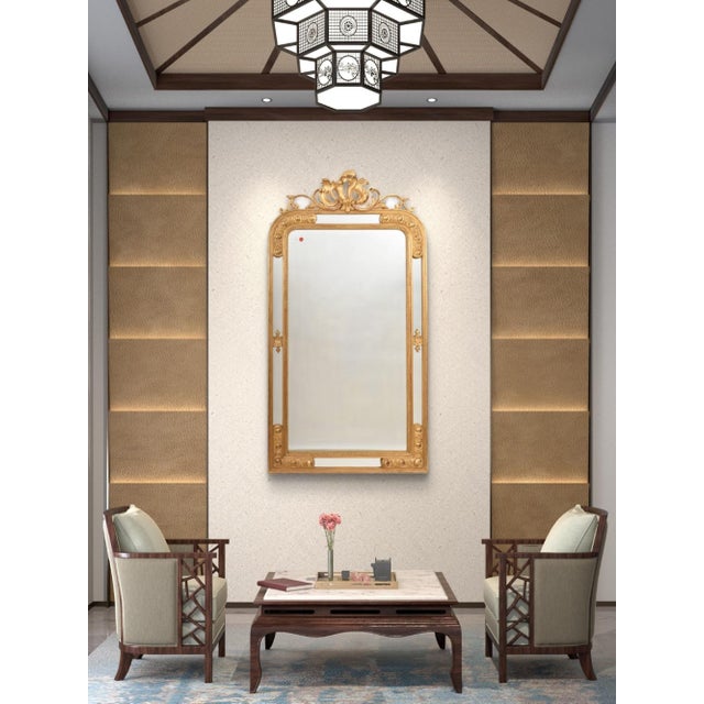 The beautiful Antique Gilded Mirror with a sinuous scrollwork cymatium, offered here, is richly decorated and dates back...