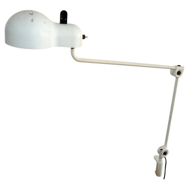 This Stilnovo architectural Steel clamp desk or table lamp with Antique white lacquered Finish is adjustable and has a...