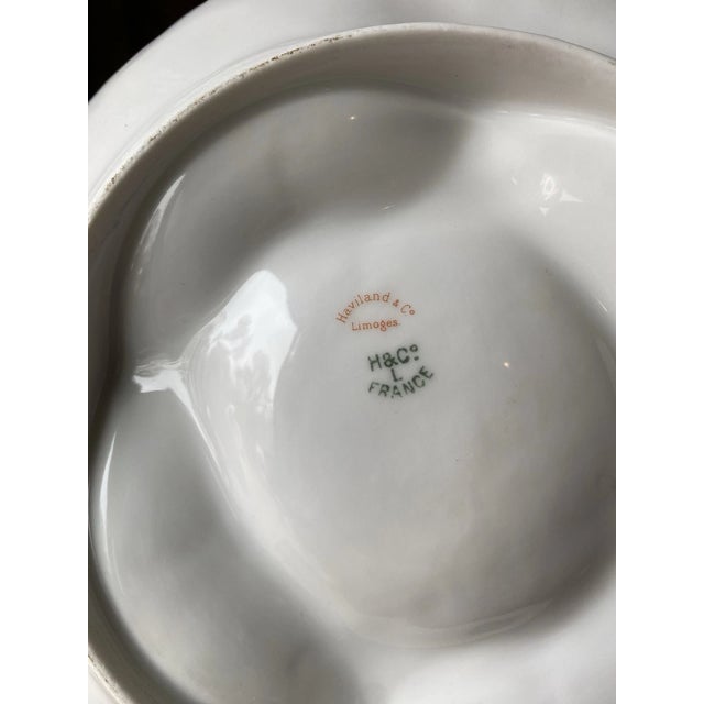 Elegant vintage oyster plate crafted by the renowned French porcelain maker Haviland & Co. Limoges. This beautiful piece...