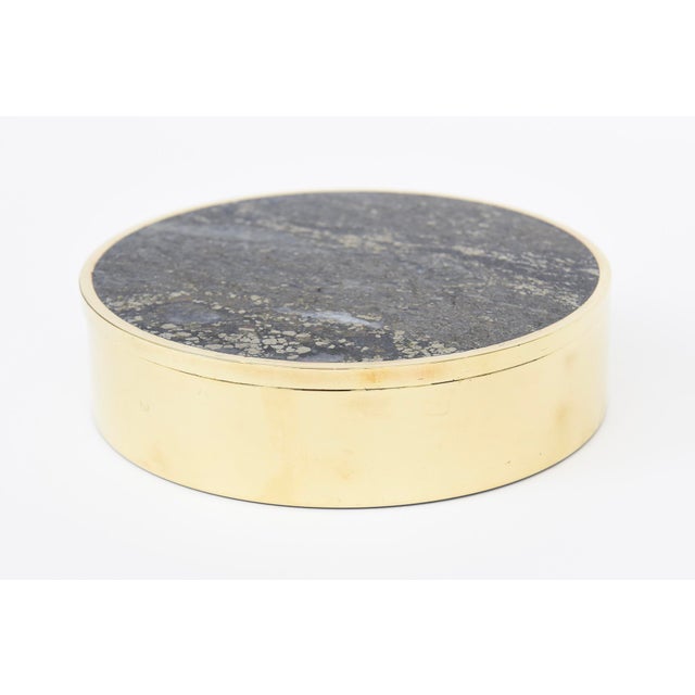 This vintage polished Scandinavian modern round fabulous box is a combination of polished stone and brass. It is from the...