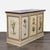 This entertainment center features a classic cream finish with a marble top and hand-painted floral designs on the doors...