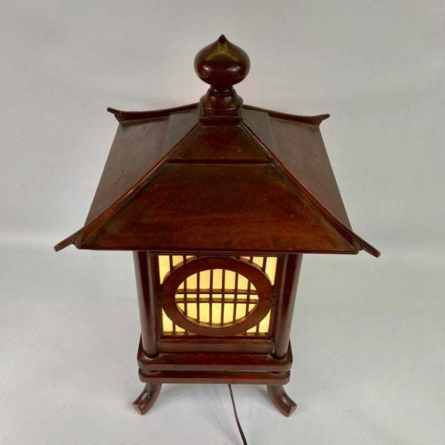 A beautifully crafted indoor wooden light. This is vintage, early 1990s but has never been used. The lighting is a cord...