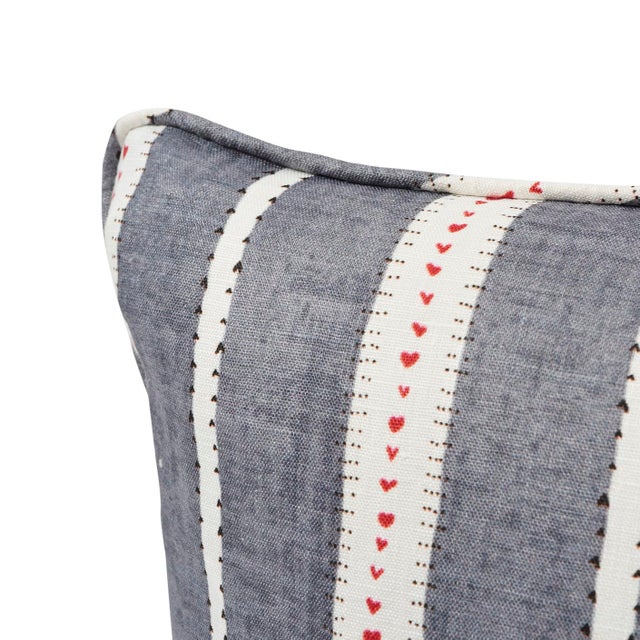 This pillow features Amour with a self welt finish. Amour is an especially lovely stripe created by Schumacher's design...