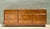 This vintage Drexel Campaign dresser is a quintessential example of mid-century functionalism married to high-end...
