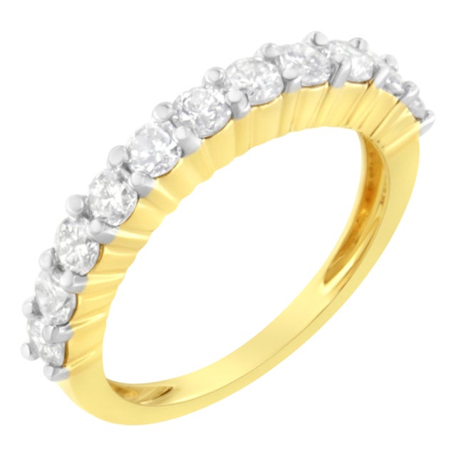 Elegant and timeless, this diamond wedding band features your choice of either 0.5 or 1.0 carat total weight of diamonds...
