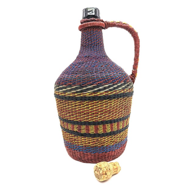 Known originally as Defiance or Dissident, or Scoubidou Bottles, this is a vintage mid 20th Century liquor jug created in...