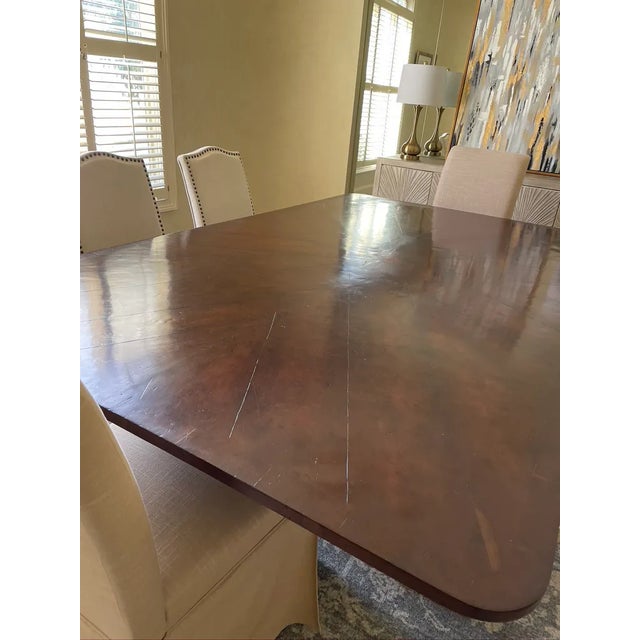 Beautiful european antique, wood dining table with inlaid wood star and iron base. Top can be removed from base for easy...