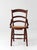 A late 19th century Eastlake style chair with a shaped ladder back, incised carved crest rail, and woven cane seat. The...
