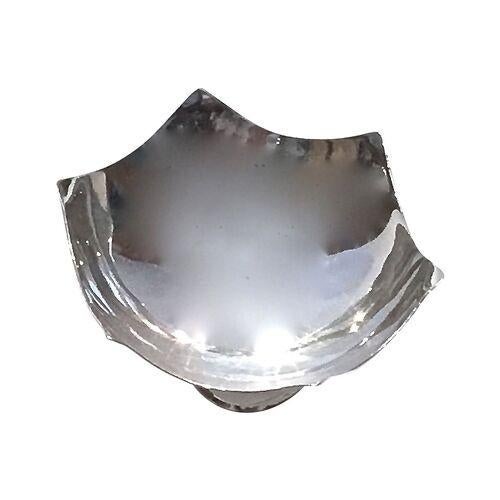 Vintage sterling silver salt dish made by Cartier. Abstract circular feet design and star-cut dish shape. Dish was made in...