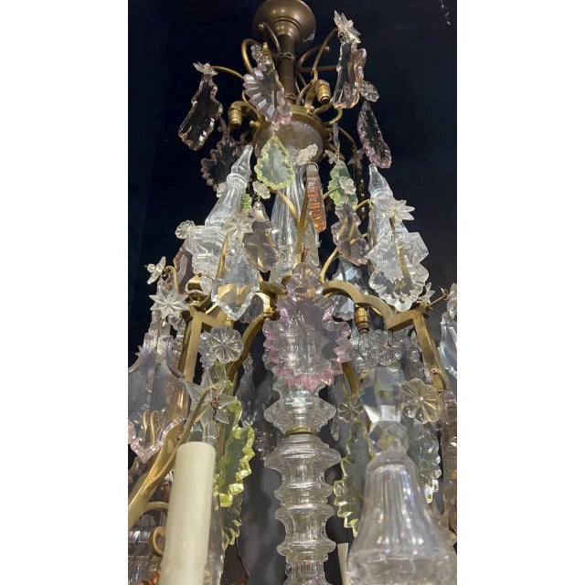 A circa 1920’s large bronze chandelier with crystal pendants