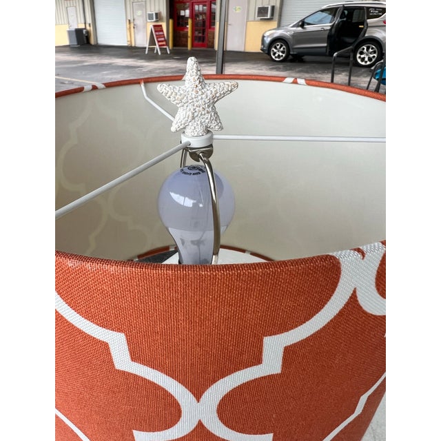 Add a vibrant pop of color and pattern to your space with this transitional drum lamp shade. Featuring a bold orange...