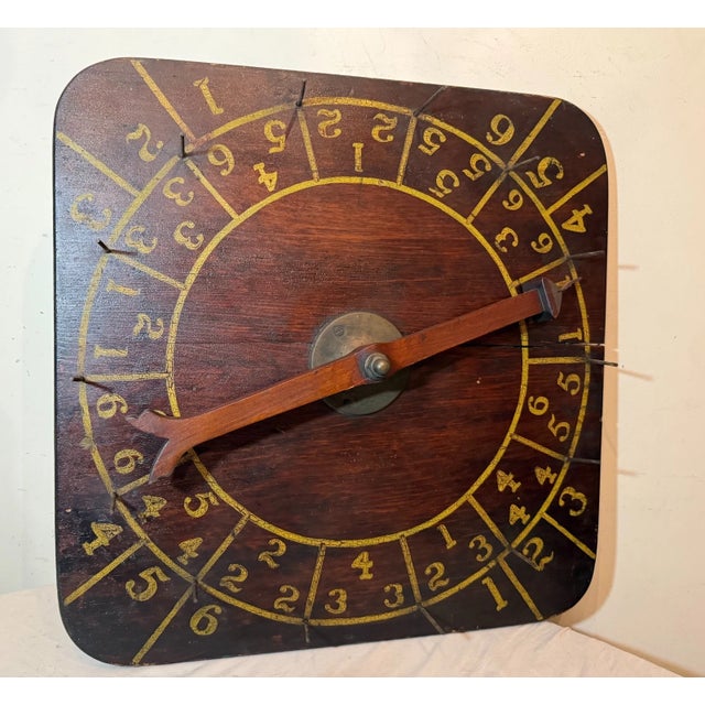This rare antique hand-made wood and brass carnival wheel is a unique and vintage piece that showcases the craftsmanship...