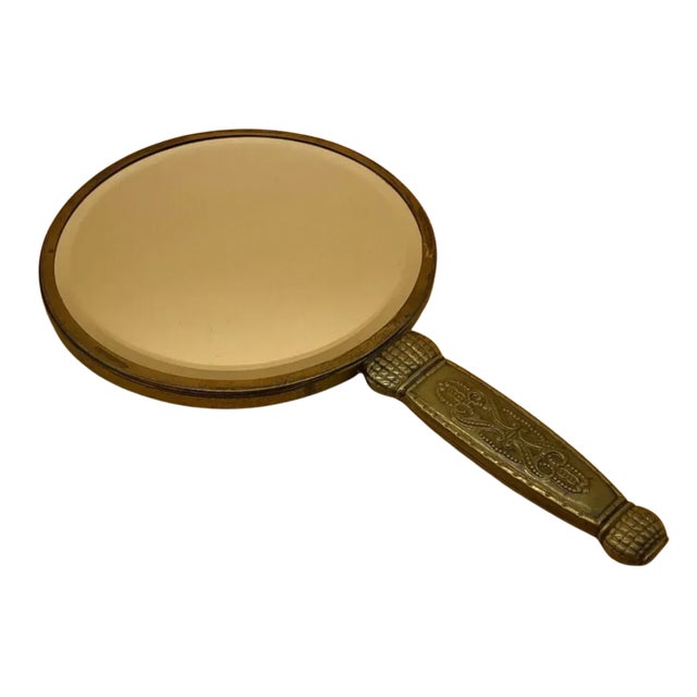 Inspired by the graceful elegance of the Art Nouveau movement, this vintage Spanish bronze hand mirror is richly decorated...