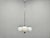 An elegant Art Deco chandelier produced in Czechoslovakia during the 1930s, featuring a sophisticated combination of...