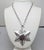1970s rhodium plated star pendant on a chain with spring ring clasp necklace. Marked "TRIFARI©" with a crown over the T on...