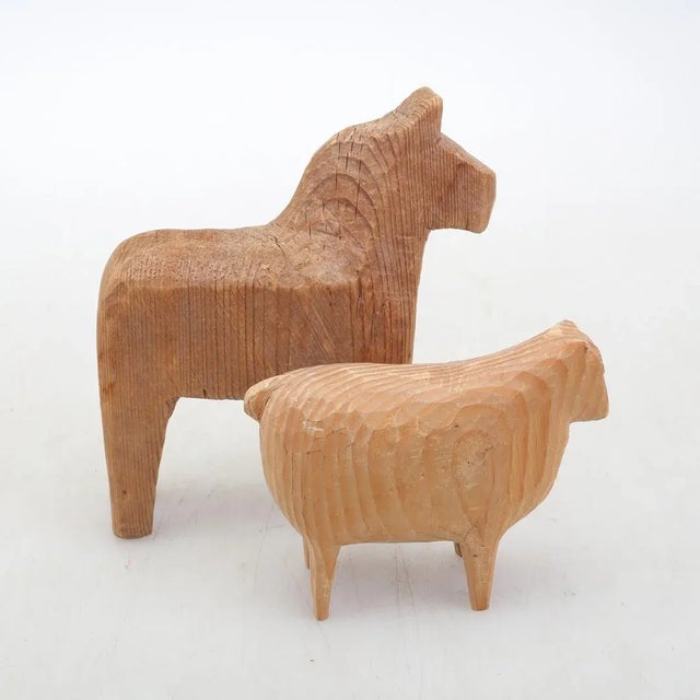 Original Dalahäst (Swedish horse of luck) and a sheep from old times\.\.a completely original pair of animals in the...