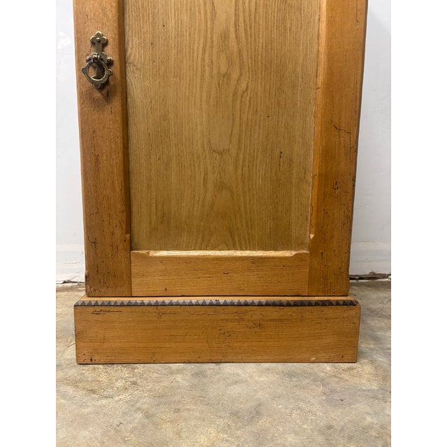 A quiet companion for bedside or hallway, built to last a lifetime. This antique English oak pot cupboard nightstand...