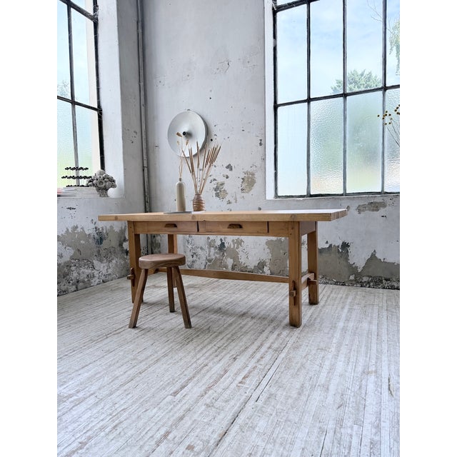 A 1950s solid beechwood mountain-style dining table. We love its dimensions, the size of its tabletop, the details and...