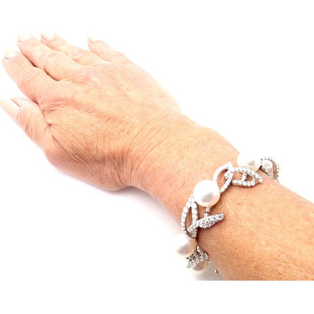 About This Piece: Metal: 18k White Gold Length: 19mm Width: 7" Weight: 9.4 grams Stones: 213 round brilliant cut diamonds...