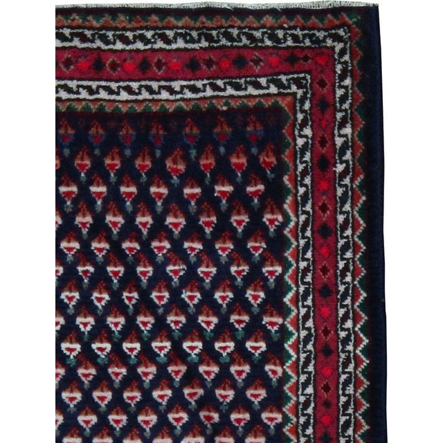 A vintage Persian hamadan rug from the mid-20th century. Hamadan town and the surrounding weaving area of about 120...