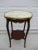 Circa 19TH Century French Louis XV style marble top side table with lower shelf. This piece features brass appliques along...