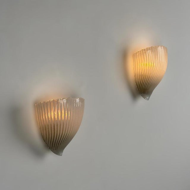 An exceptionally rare and historically important pair of Murano glass wall sconces designed by Carlo Scarpa for Venini...