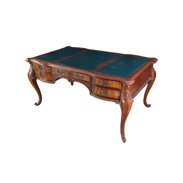 Late 20th Century Chippendale Style Desk. Made from mahogany with a three panel green leather inset top and flame mahogany...
