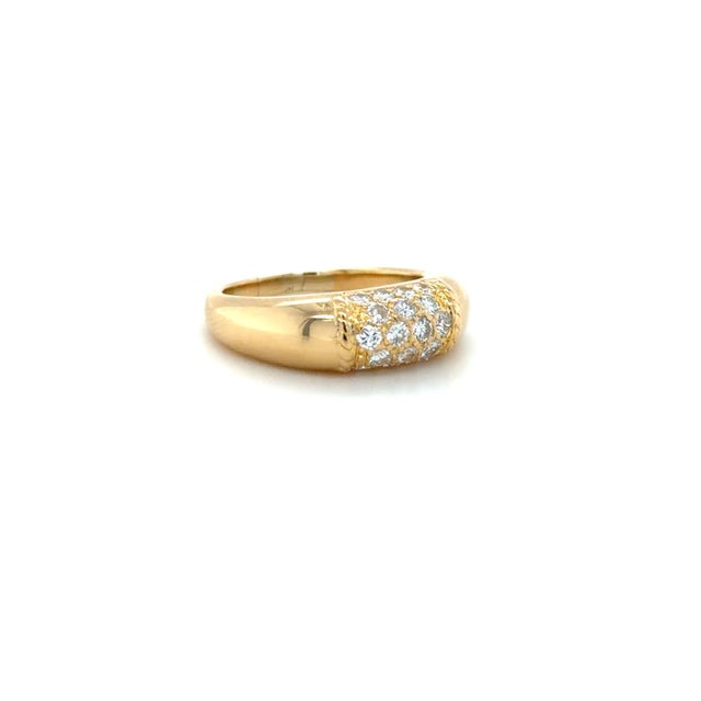 This classic ring by Van Cleef & Arpels in their Philippines Collection, is in a domed bombé style with pavé set round...