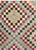 This mid-20th-century Turkish Anatolian rug presents a lively checkerboard composition formed from small, evenly scaled...