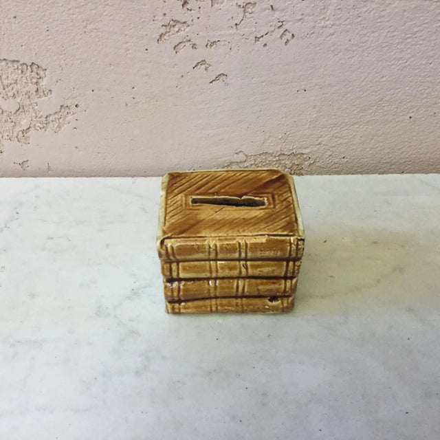 Majolica moneybank books made by Onnaing. The piece was crafted circa 1900.